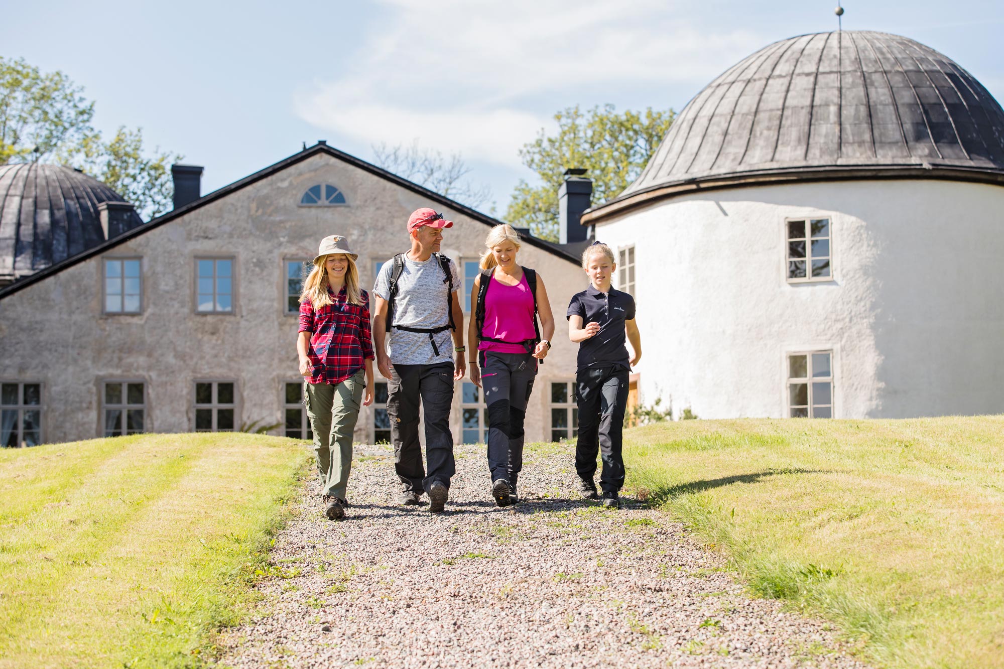 Family of four takes a stroll in brilliant sunshine